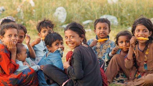 Happy Pakistani kids enjoying popsicles