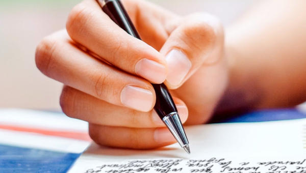 Handwriting a letter closeup