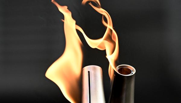 Two Olympic torches in Paris Olympics relay