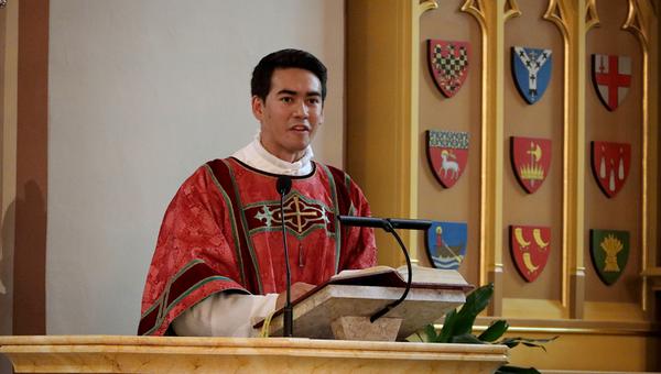 Deacon Mathias Bruno Ledum addresses congregation at his ordination in Oslo, Norway
