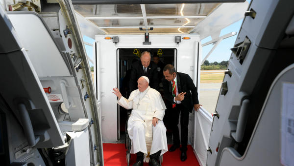Pope Francis preparing to board a plane at Presidente Nicolau Lobato International Airport in Dili before departing for Singapore.