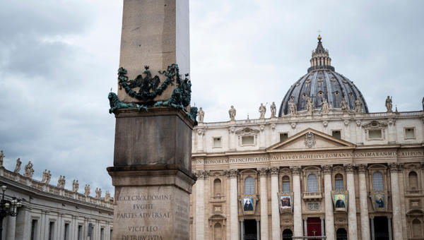A tapestry of the Martyrs of Damascus, Blessed Elena Guerra, Blessed Giuseppe Allamano, and Blessed Marie-Léonie Paradis is displayed on the facade of St. Peter's Basilica at the Vatican