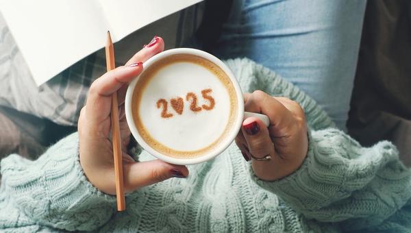 New year 2025 celebrated coffee cup with number 2025 on frothy surface of cappuccino