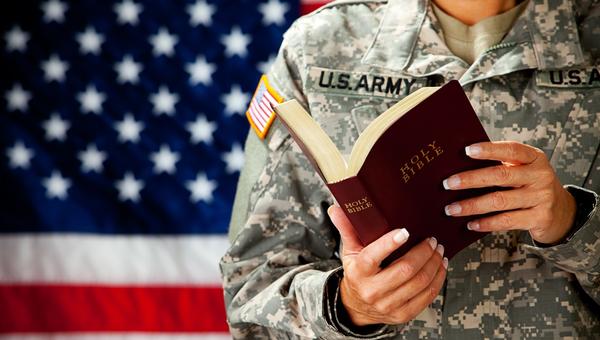 US Service Member Holds Bible