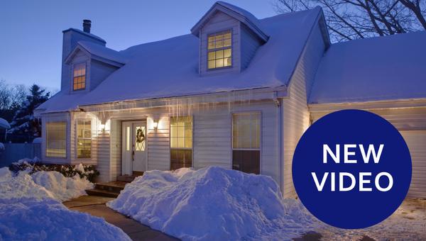 house with snow and ice at night