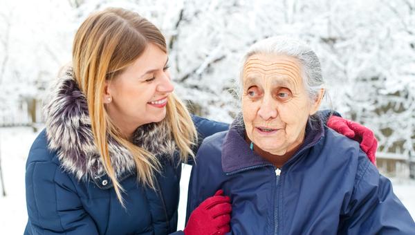 Woman with elderly woman winter