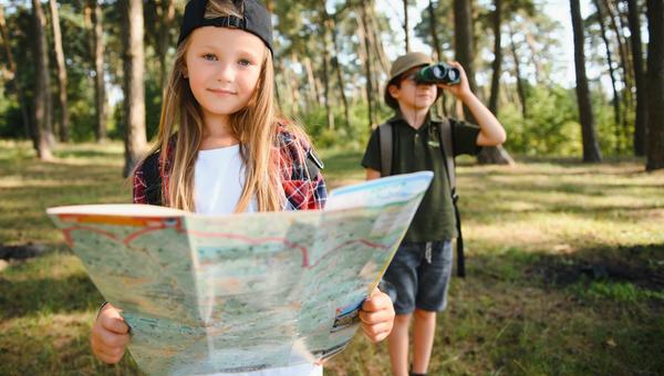 girl with map and boy with binoculars