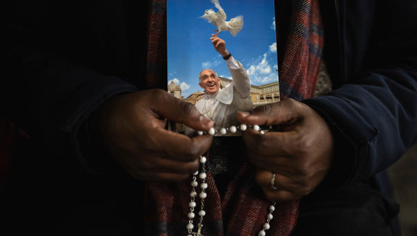 Priest pray the rosary in St. Peter's Square at The Vatican, Friday, Mar. 14, 2025