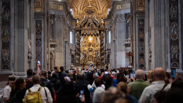 People queue at St Peter's Basilica to pay their respects to late Pope Francis as he lies in state in The Vatican, on April 24, 2025.