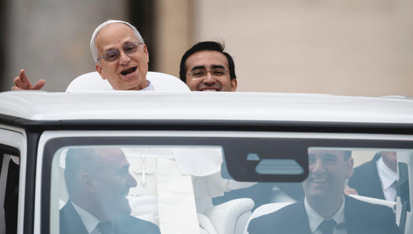 Pope Leo XIV with his personal assistant Edgard Ivan Rimaycuna Inga at the end of his first weekly general audience at St Peter's Square in The Vatican on May 21, 2025.