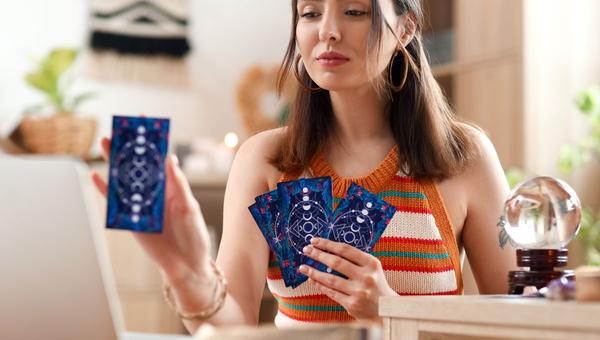 girl playing with tarot cards