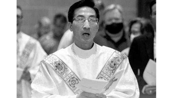 Priest holding paper