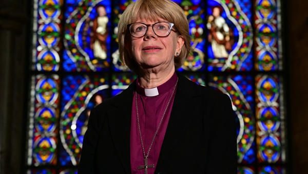 woman poising in front of stained glass