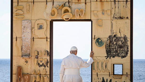 Pope Leo XIV walks trough the arch of the monument Door of Europe - Porta d'Europa made by the italian artist Mimmo Paladino, during a one day visit to Lampedusa island, south of Sicily, on July 4, 2026.