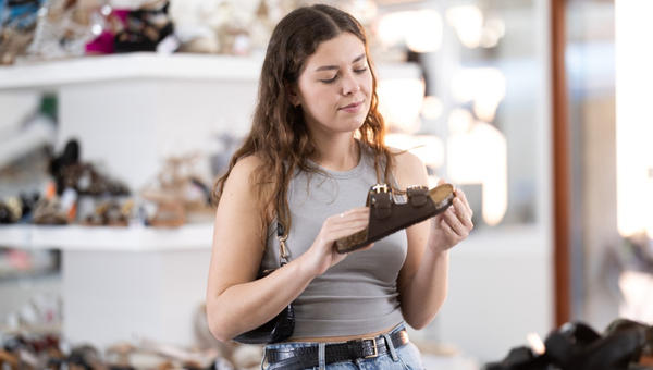 girl picking shoes in the store