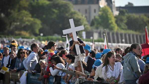 child-holds-cross-waits-pope-leo-xiv-mass-prairie-shrine-our-lady-lourdes-france-september-27-2026
