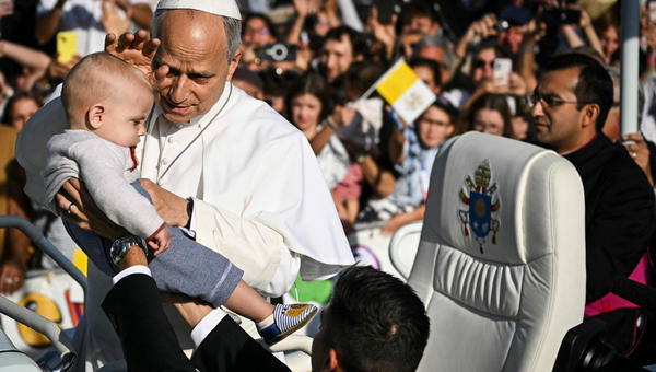 pope-leo-xiv-blesses-child-papamobile-arrives-mass-prairie-shrine-our-lady-lourdes-france-september-27-2026