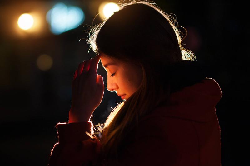 web-woman-praying-night-light-face-tymonko-galyna-shutterstock_404562580-2