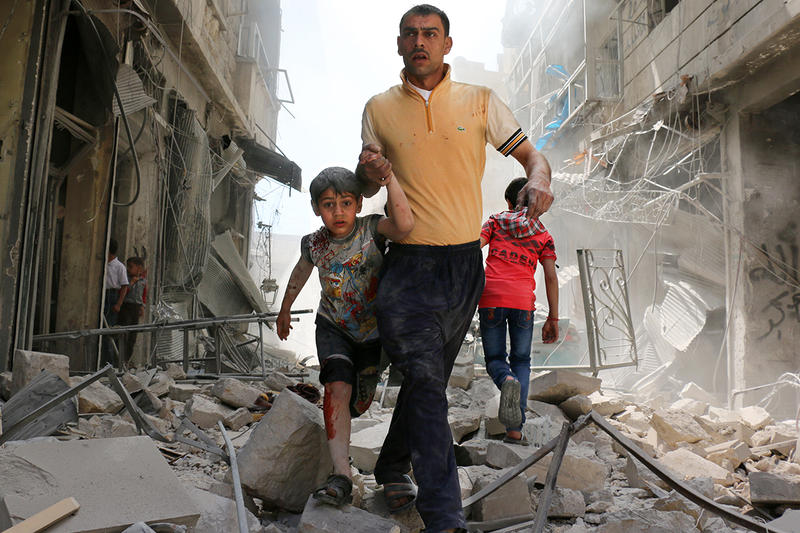 web-aleppo-father-son-rubble-000_ln7sa-ameer-alhalbi-afp