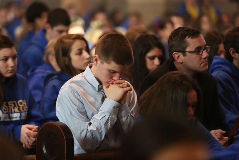 PRAYING AT MASS