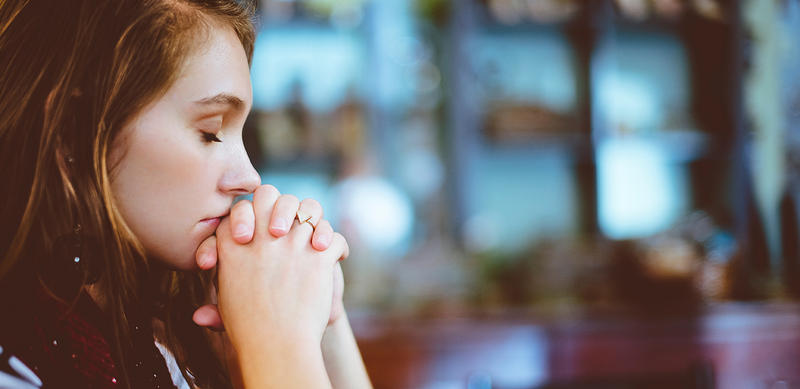 WOMAN PRAYING
