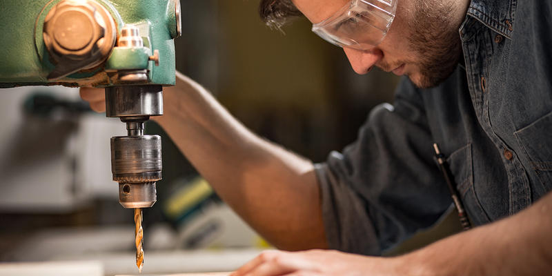 WEB3-CARPENTER-DRILL-PRESS-WORKER-MAN-shutterstock_292907969-Shutterstock