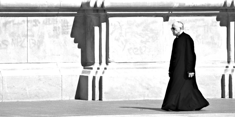 PRIEST WALKING