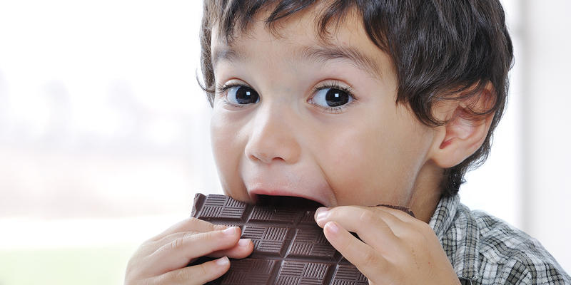 LITTLE BOY EATING CHOCOLATE