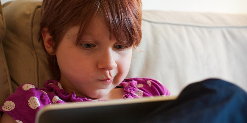 YOUNG CHILD WITH IPAD