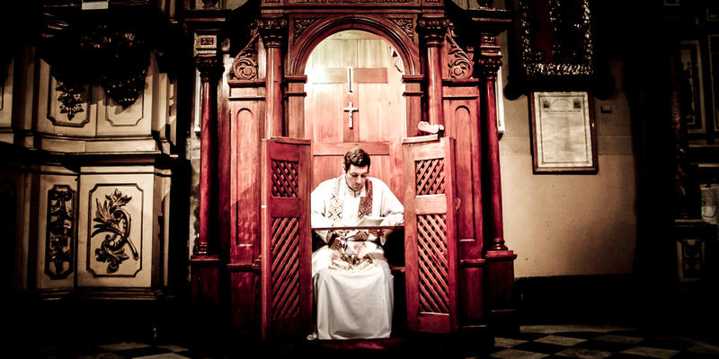 PRIEST IN CONFESSIONAL
