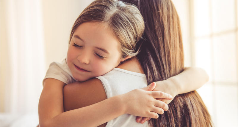 MUM AND KID HUGGING