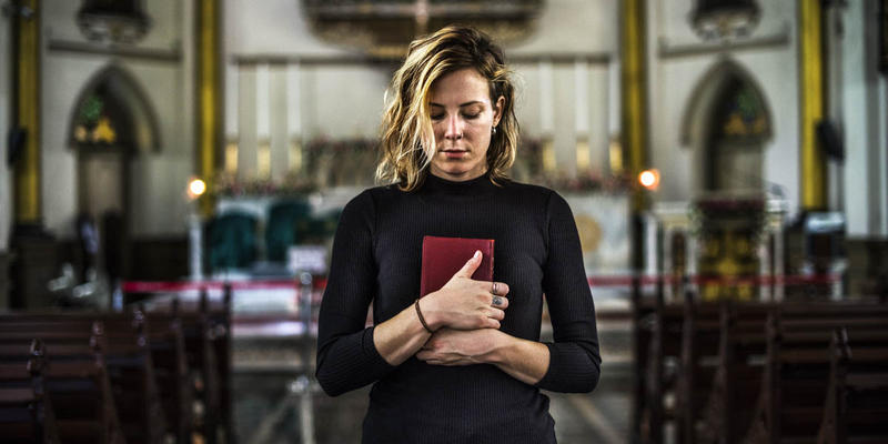 WOMAN WITH PRAYER BOOK