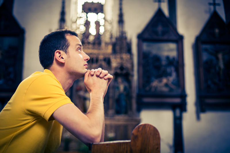 MAN PRAYING