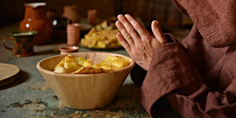 MONK EATING PRAYING