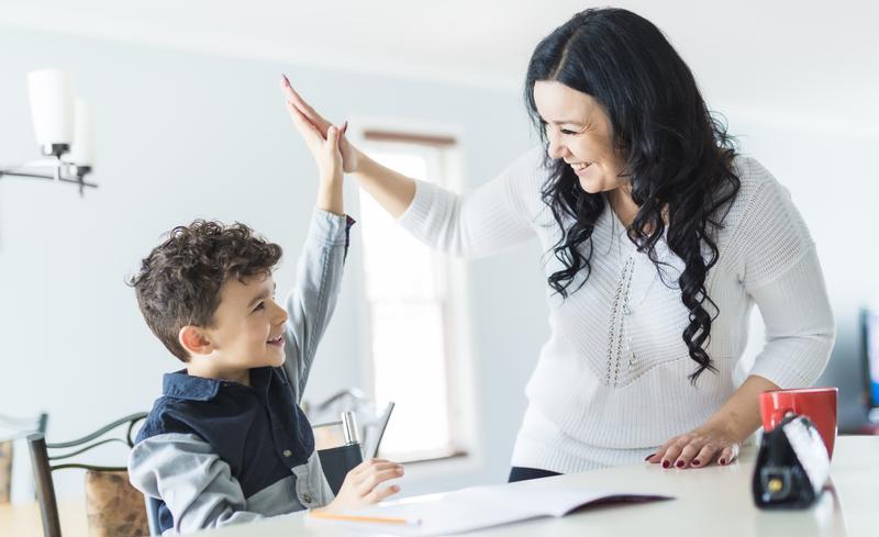 Son and mom doing homework