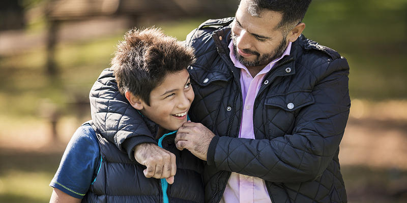 web3-father-son-park-hug-walking-outside-shutterstock_729076012-sladic-ai