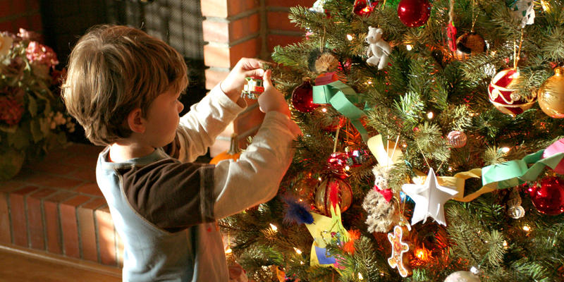 LITTLE,BOY,DECORATES,CHRISTMAS,TREE