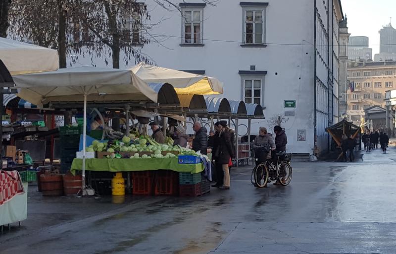 People buying sauerkraut on market in Ljubljana