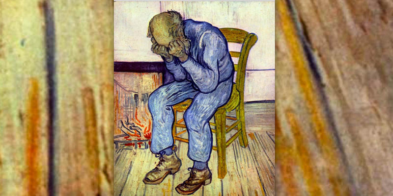 SAD MAN SITTING BY THE FIRE