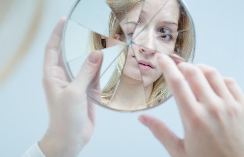 Woman looking in the mirror