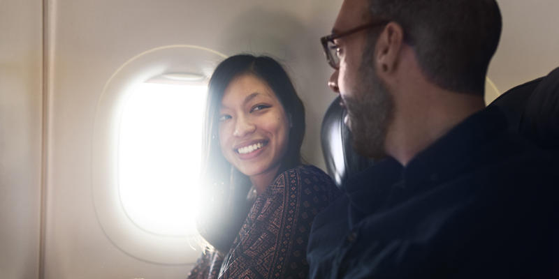 MAN,WOMAN,CONVERSATION,AIRPLANE