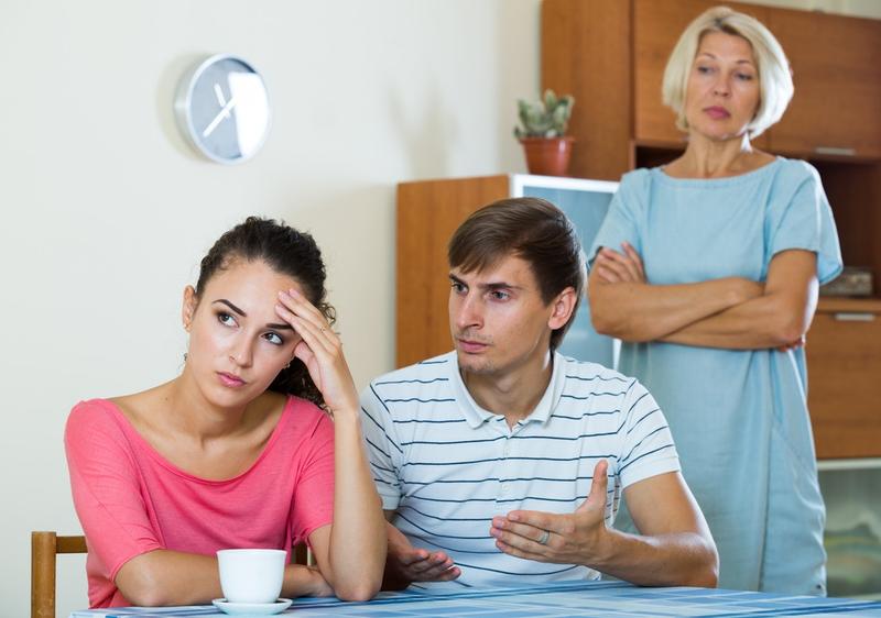 Mother in law looking at son and wife