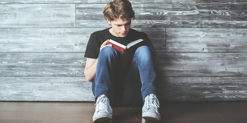 guy reading book