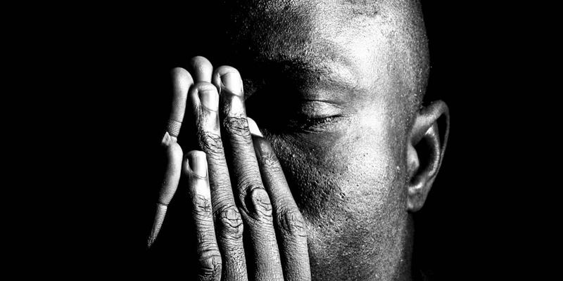 MAN PRAYING