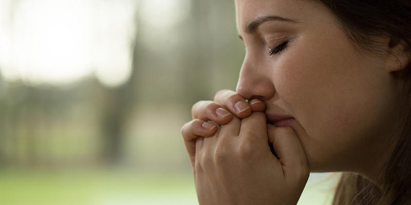WOMAN PRAYING