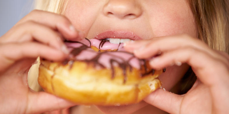 CHILD,EATING,DONUT