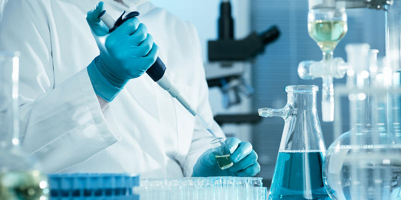 SCIENTIST WORKING AT THE LABORATORY