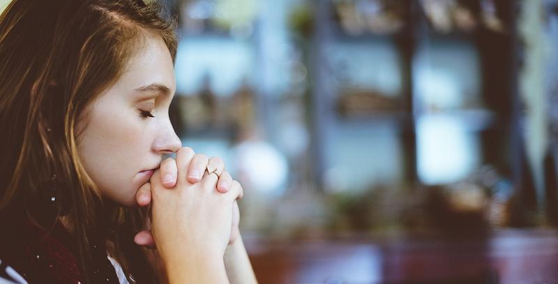 WOMAN PRAYING