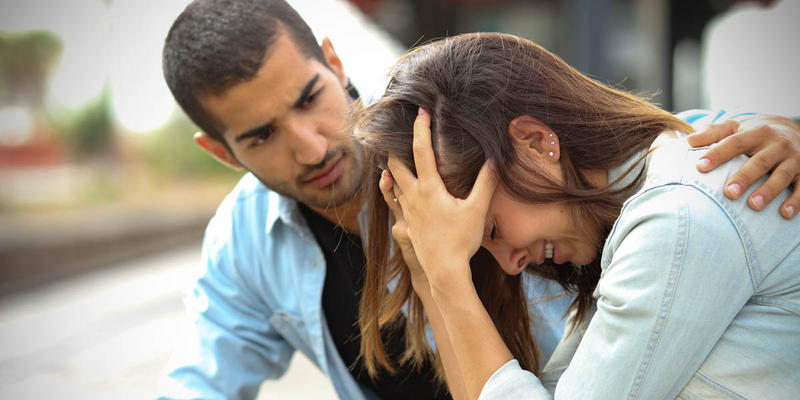MAN COMFORTING FRIEND