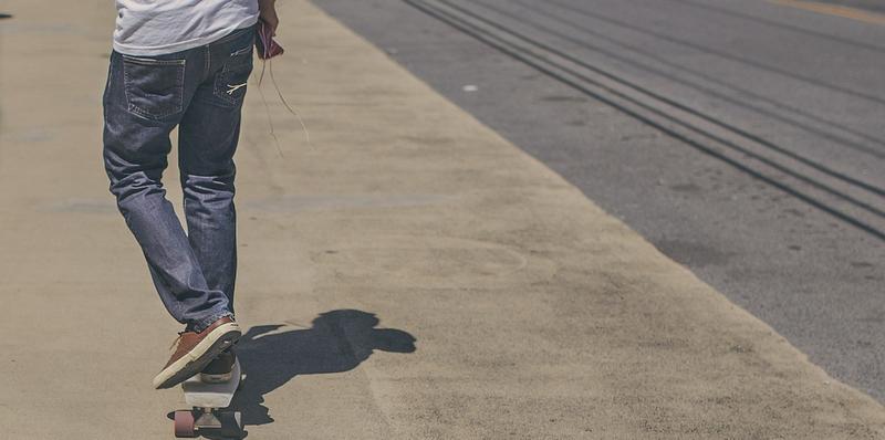 TEEN BOY ON SKATEBOARD